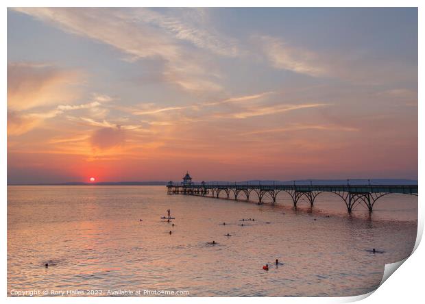 Clevedon Pier as the sun about to set over the Welsh hills Print by Rory Hailes