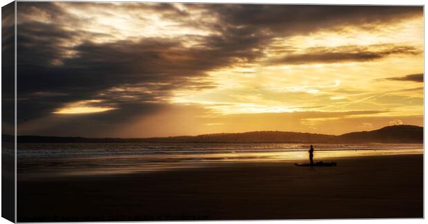 Surfer looking out to sea at Aberavon beach Port Talbot Canvas Print by Jenny Hibbert