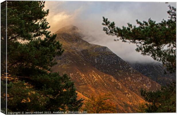 Ben Nevis peaking through the clouds Scotland Canvas Print by Jenny Hibbert