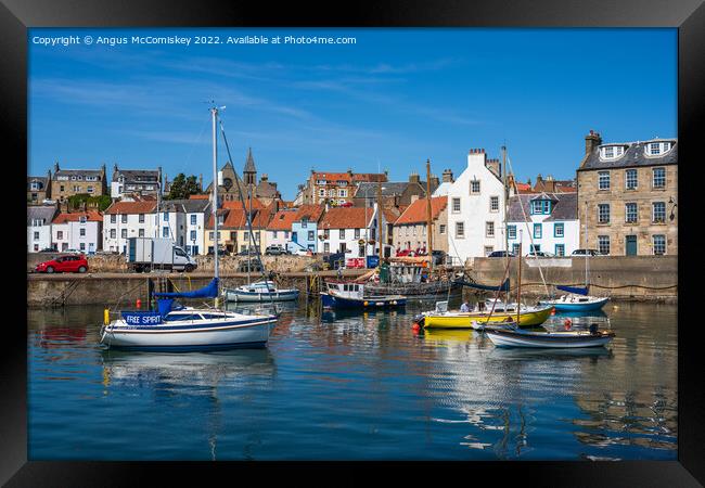 Boats moored in St Monans harbour Framed Print by Angus McComiskey