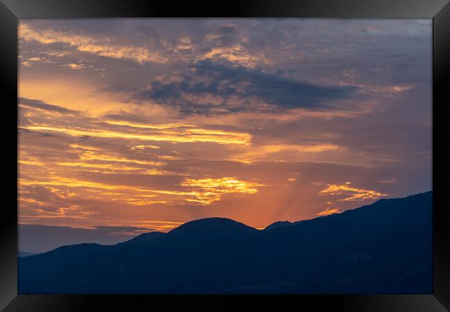 Silhouette Sunset  Framed Print by Jonny Gios