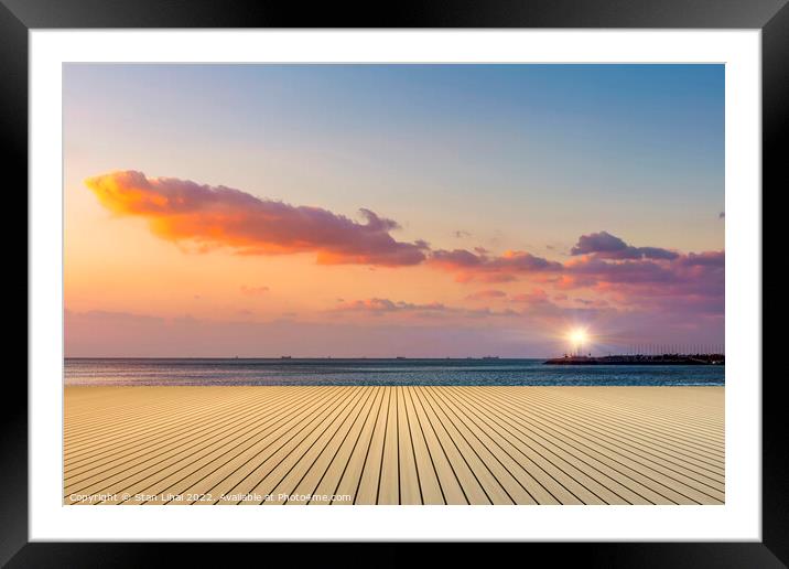 Sunset over the beach Framed Mounted Print by Stan Lihai