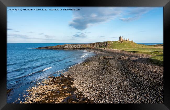 Dunstanburgh Castle from the north elevated Framed Print by Graham Moore