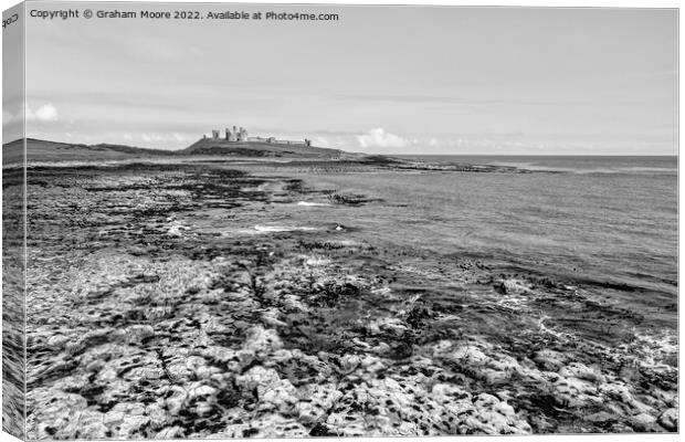 Dunstanburgh Castle from the south elevated monochrome Canvas Print by Graham Moore