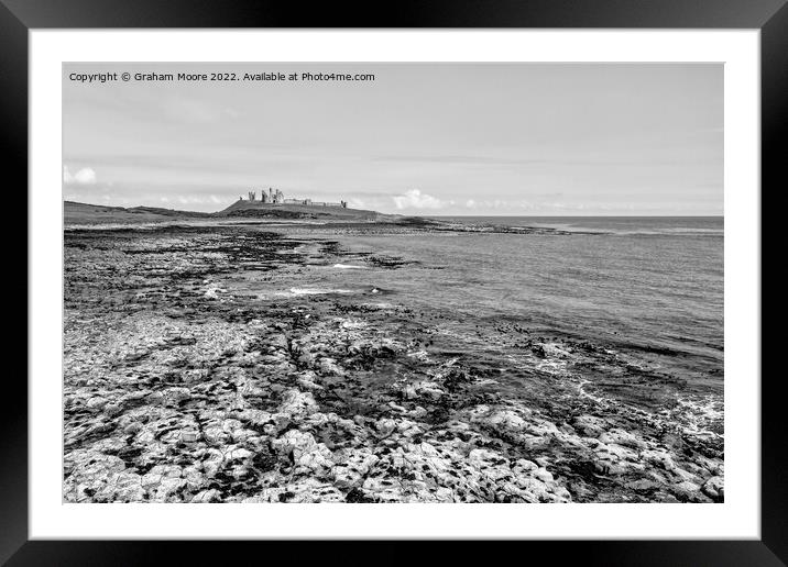 Dunstanburgh Castle from the south elevated monochrome Framed Mounted Print by Graham Moore