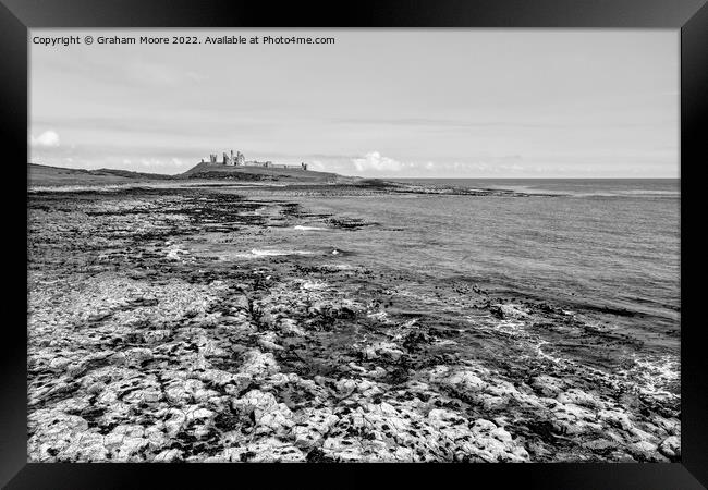 Dunstanburgh Castle from the south elevated monochrome Framed Print by Graham Moore