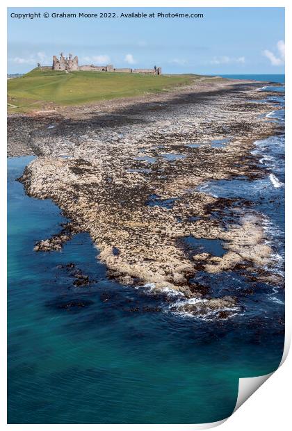 Dunstanburgh Castle from the sea elevated Print by Graham Moore