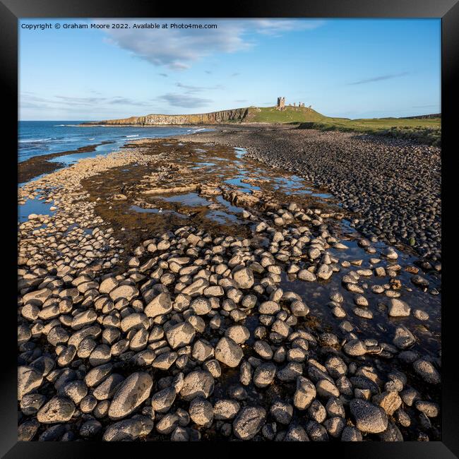 Dunstanburgh Castle from the north elevated evening Framed Print by Graham Moore