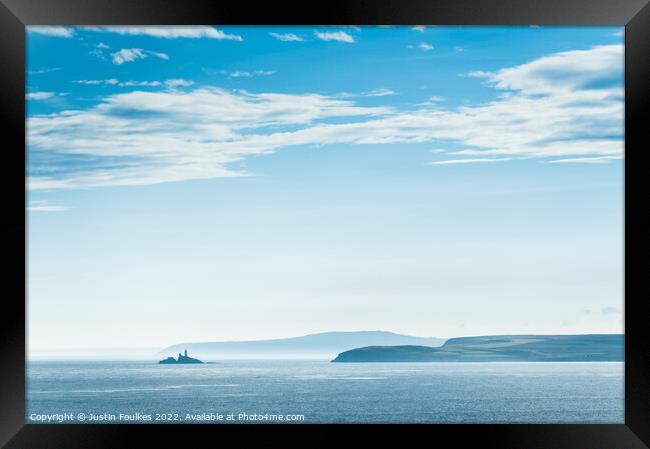 Blue skies over Godrevy Lighthouse, Cornwall Framed Print by Justin Foulkes