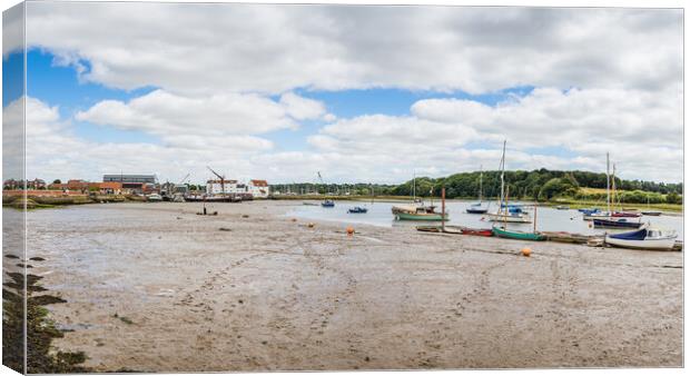 Footprints in the silt on Woodbridge waterfront Canvas Print by Jason Wells
