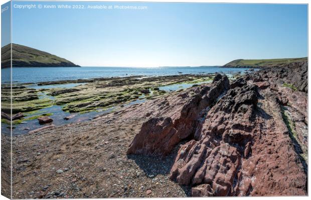 Pure blue skies over Manorbier beach in Pembrokshi Canvas Print by Kevin White