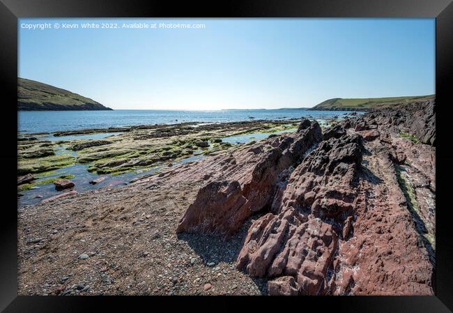 Pure blue skies over Manorbier beach in Pembrokshi Framed Print by Kevin White