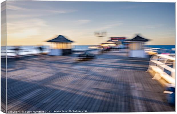 Dancing pavilion on a calm sunset Canvas Print by Terry Newman