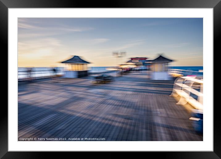 Dancing pavilion on a calm sunset Framed Mounted Print by Terry Newman