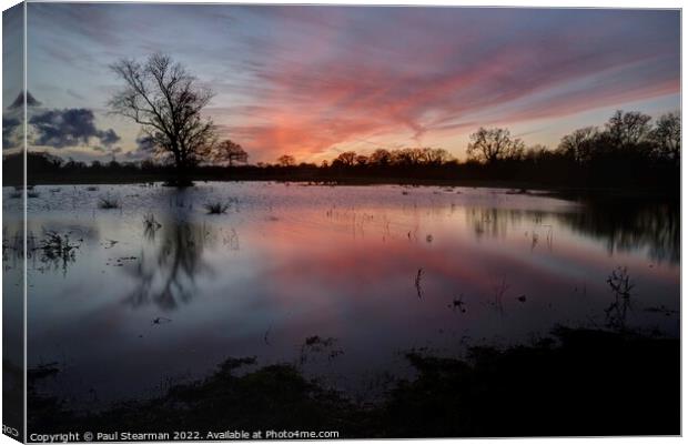 Sunset with flooded fields at Esling Norfolk UK Canvas Print by Paul Stearman