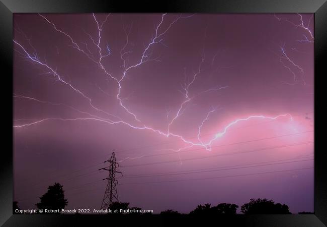 Lightning in the sky at night Framed Print by Robert Brozek