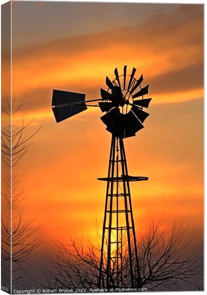 Kansas Golden Sunset with a windmill silhouette Canvas Print by Robert Brozek