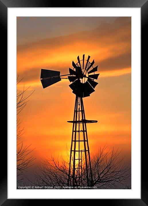 Kansas Golden Sunset with a windmill silhouette Framed Mounted Print by Robert Brozek