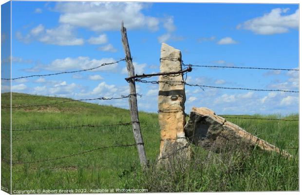 Outdoor stone post fence with grass Canvas Print by Robert Brozek