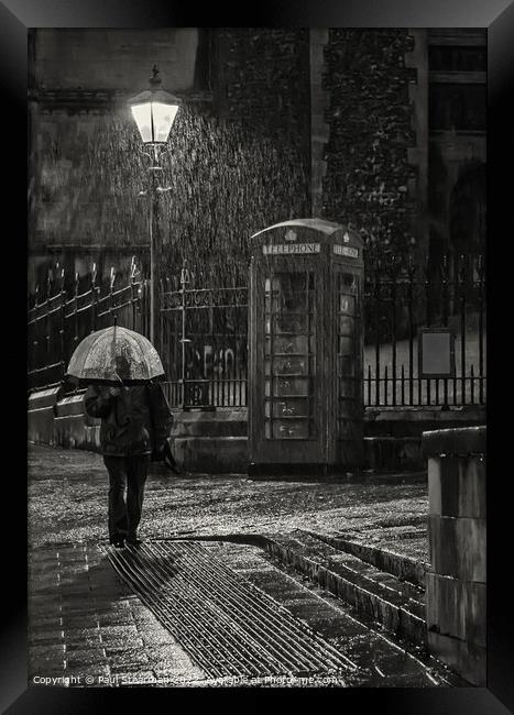 Rain downpour at Norwich market with umbrella man Framed Print by Paul Stearman
