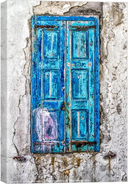 Old blue shutters against a faded plaster wall Canvas Print by Kevin Hellon
