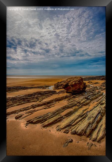 Rocks on Saunton Sands Framed Print by Derek Daniel