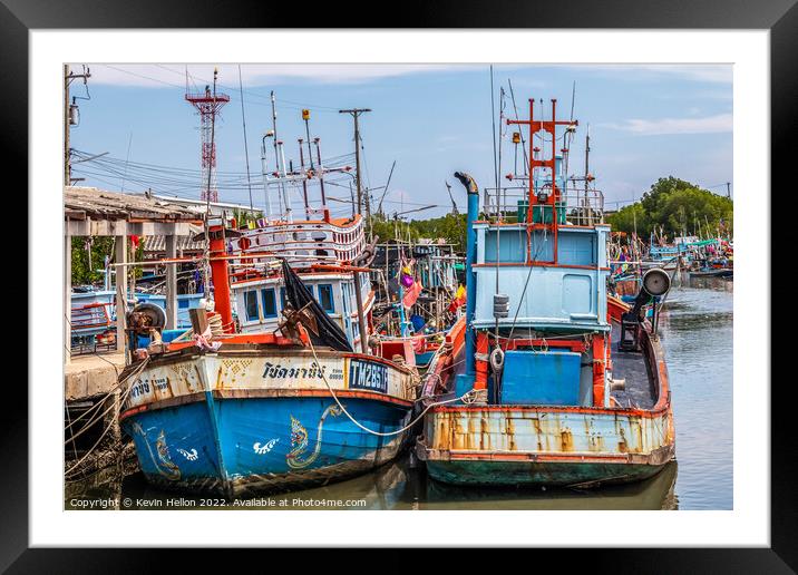Thai fishing boats in harbour Framed Mounted Print by Kevin Hellon