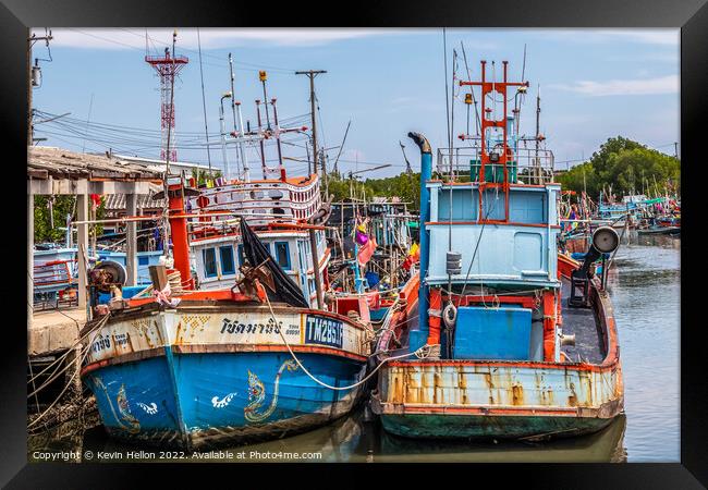 Thai fishing boats in harbour Framed Print by Kevin Hellon