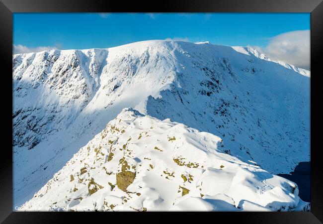 Striding Edge in winter, Helvellyn, Lake District Framed Print by Justin Foulkes