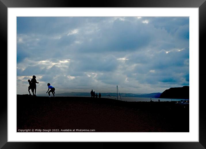 Youngsters playing on an evening beach Framed Mounted Print by Philip Gough