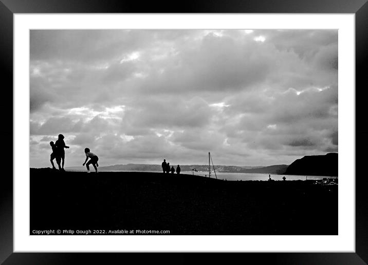 Evening playtime on the beach Framed Mounted Print by Philip Gough