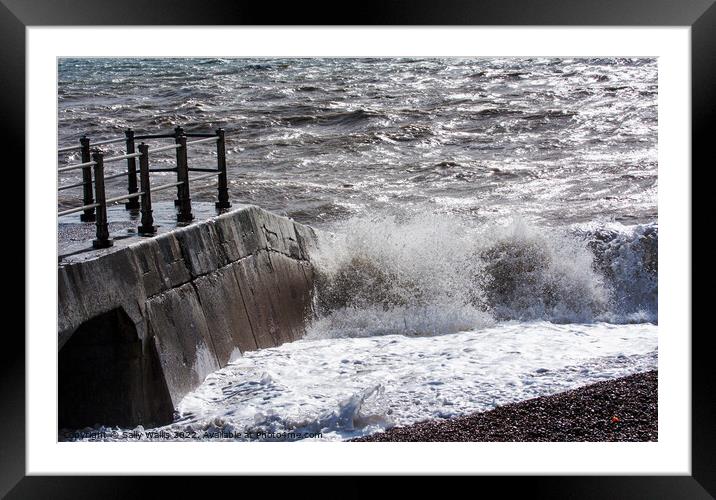 Waves breaking against concrete Framed Mounted Print by Sally Wallis