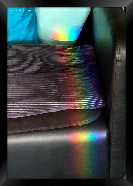Prisms of rainbow colours over chair & cushion Framed Print by DEE- Diana Cosford