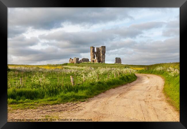 Winding road leading to a chirch ruin in Norfolk Framed Print by Simon Bratt LRPS