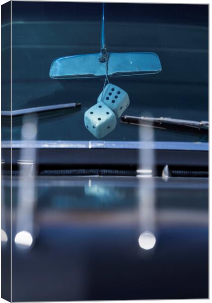 Fluffy dice hang from rear view mirror Canvas Print by Phil Crean