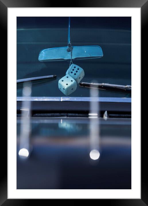 Fluffy dice hang from rear view mirror Framed Mounted Print by Phil Crean