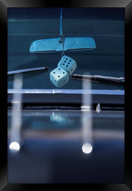 Fluffy dice hang from rear view mirror Framed Print by Phil Crean