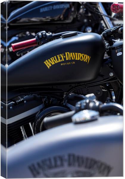Abstract detail of a row of parked Harley davidson bikes Canvas Print by Phil Crean