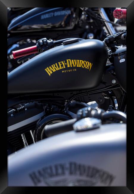 Abstract detail of a row of parked Harley davidson bikes Framed Print by Phil Crean