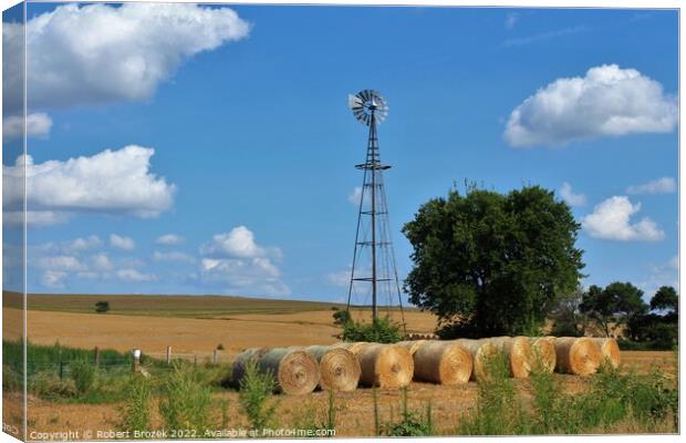 sky with windmill and haybales Canvas Print by Robert Brozek