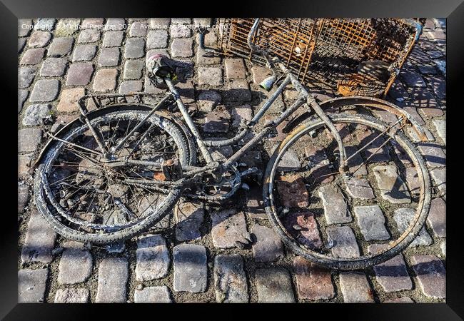 Rusty bicycle got out water from cleaning the port of Kiel in Ge Framed Print by Michael Piepgras