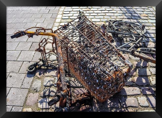 Rusty and damaged shopping cart found in the port of Kiel in Ger Framed Print by Michael Piepgras