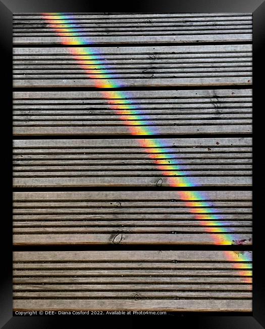 Prisms of light travelling over the decking. Framed Print by DEE- Diana Cosford