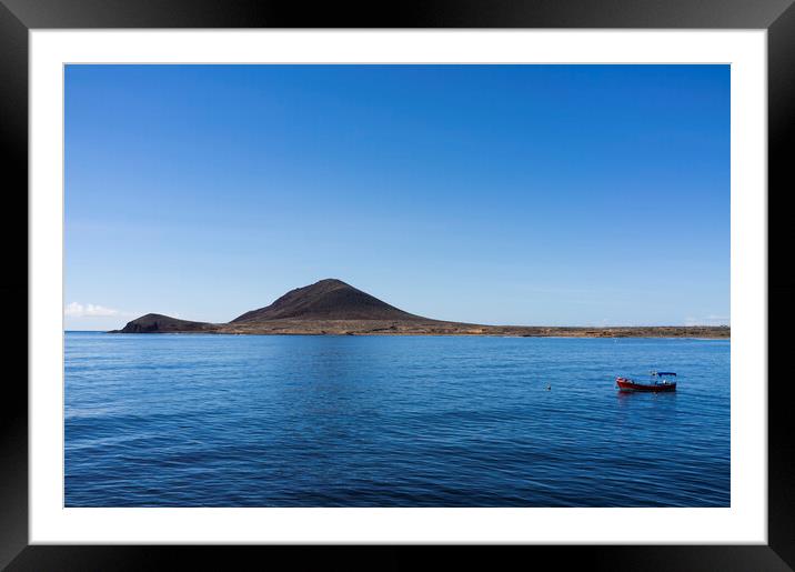 Red boat in the blue sea, El Medano, Tenerife Framed Mounted Print by Phil Crean