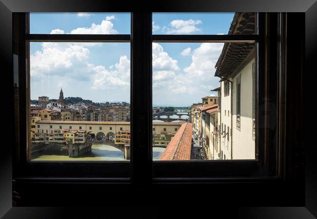 Ponte Vecchio over the river Arno in Florence Framed Print by Phil Crean