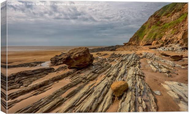 Rocks on Saunton Sands Canvas Print by Derek Daniel