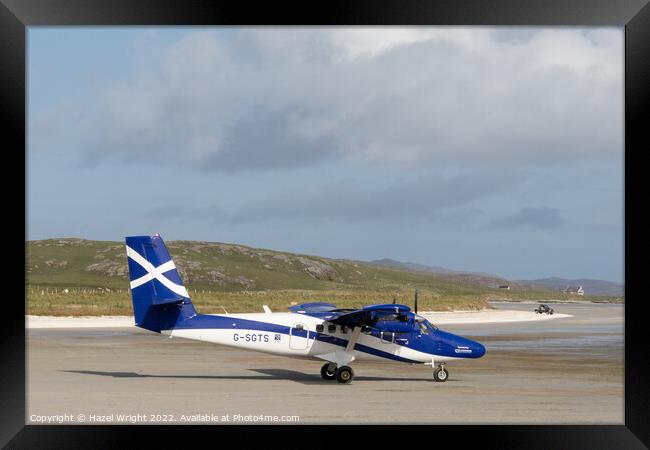 Plane at Barra airport Framed Print by Hazel Wright