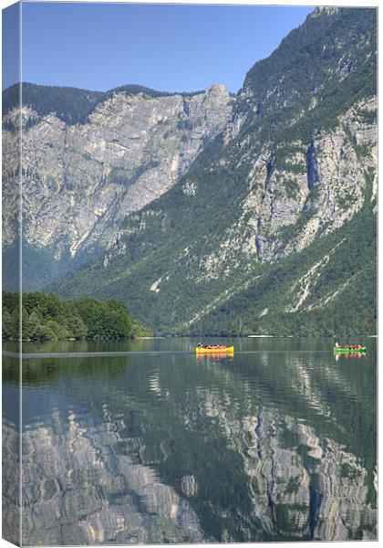Alpine reflections Canvas Print by Ian Middleton