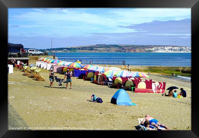 Line of Parasols on Shanklin beach on the Isle of Wight. Framed Print by john hill