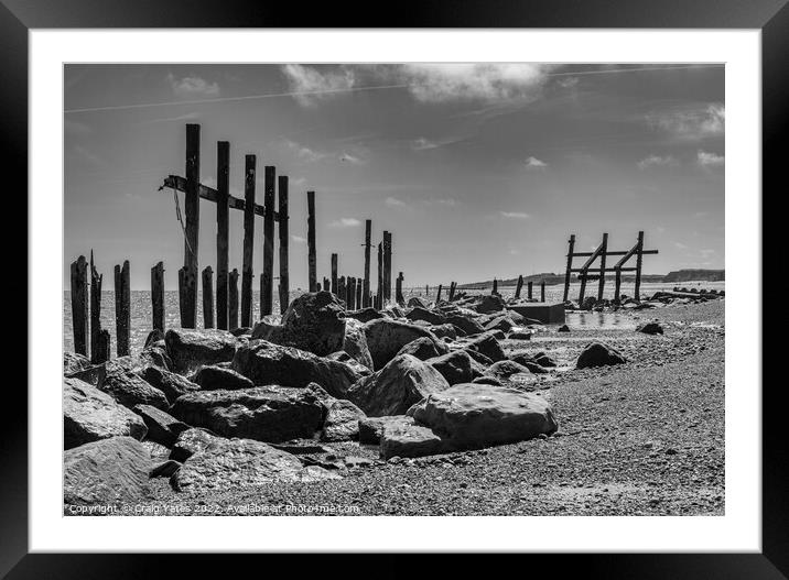 Happisburgh wooden sea defences black and white. Framed Mounted Print by Craig Yates